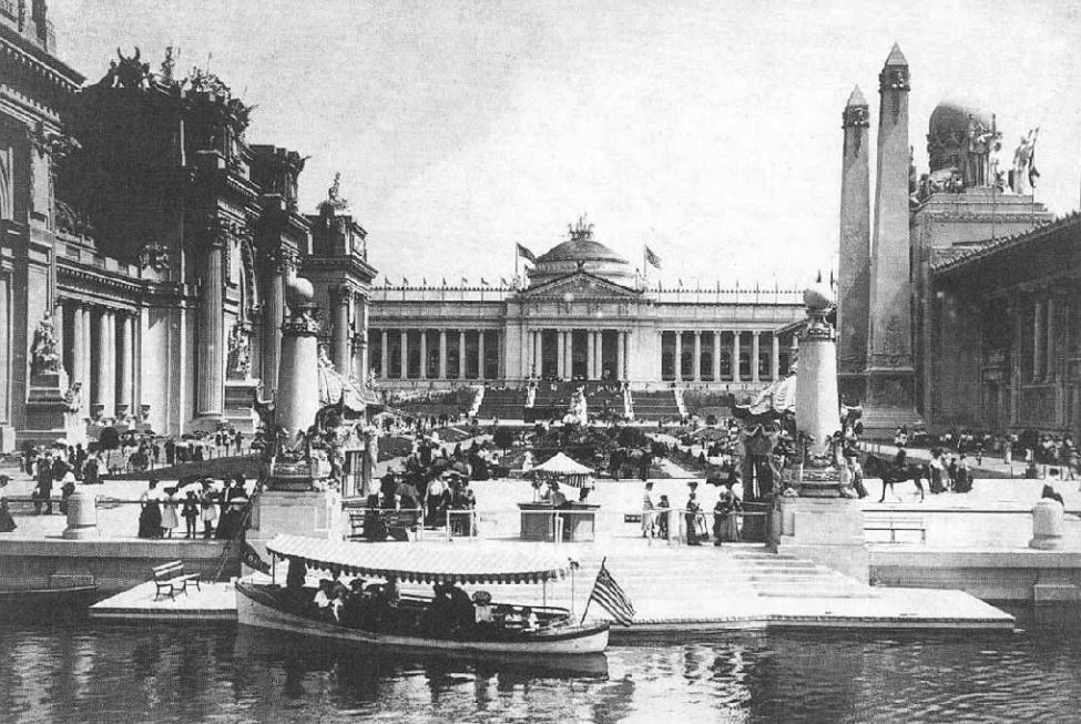 a black and white photo of a building with columns and a boat