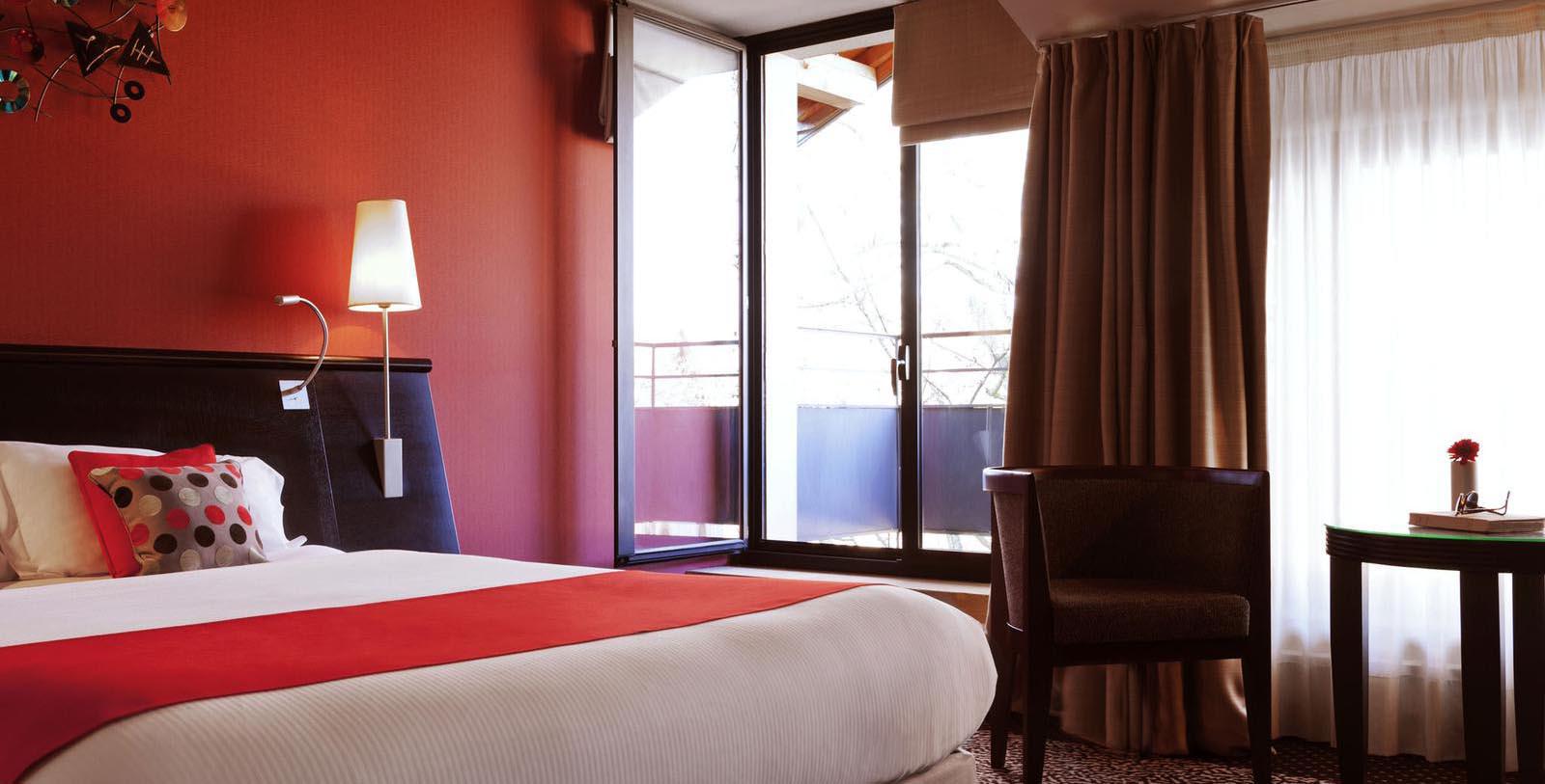 a bedroom with a bed and a chair