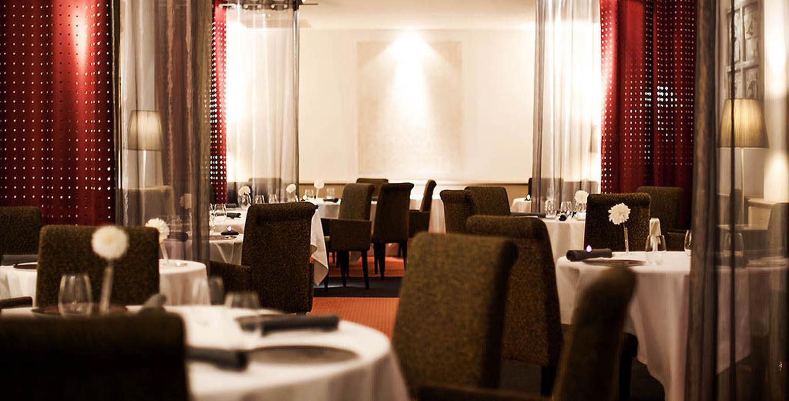a restaurant with tables and chairs