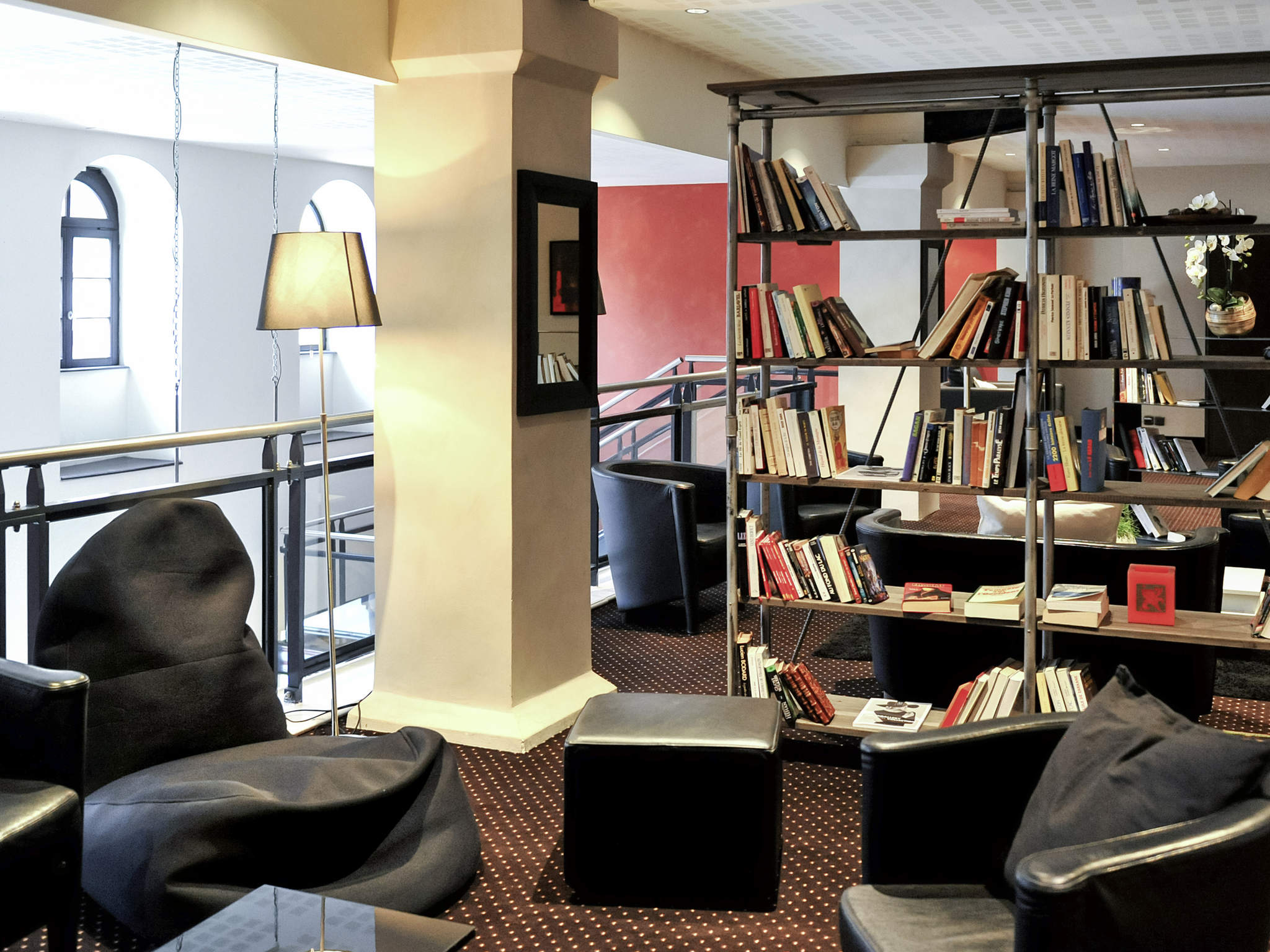 a room with a book shelf and a couch