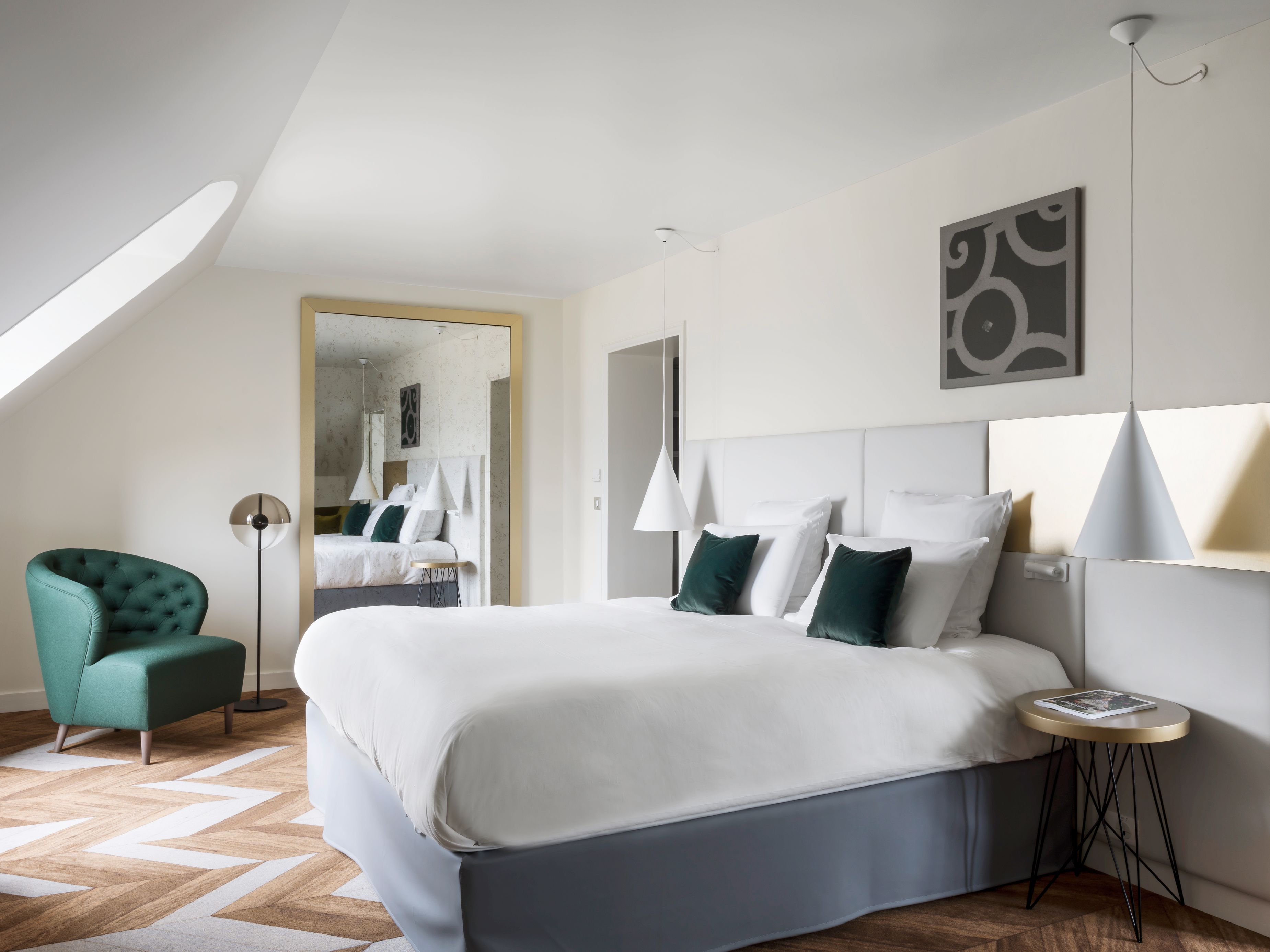 a bedroom with a bed and a chair