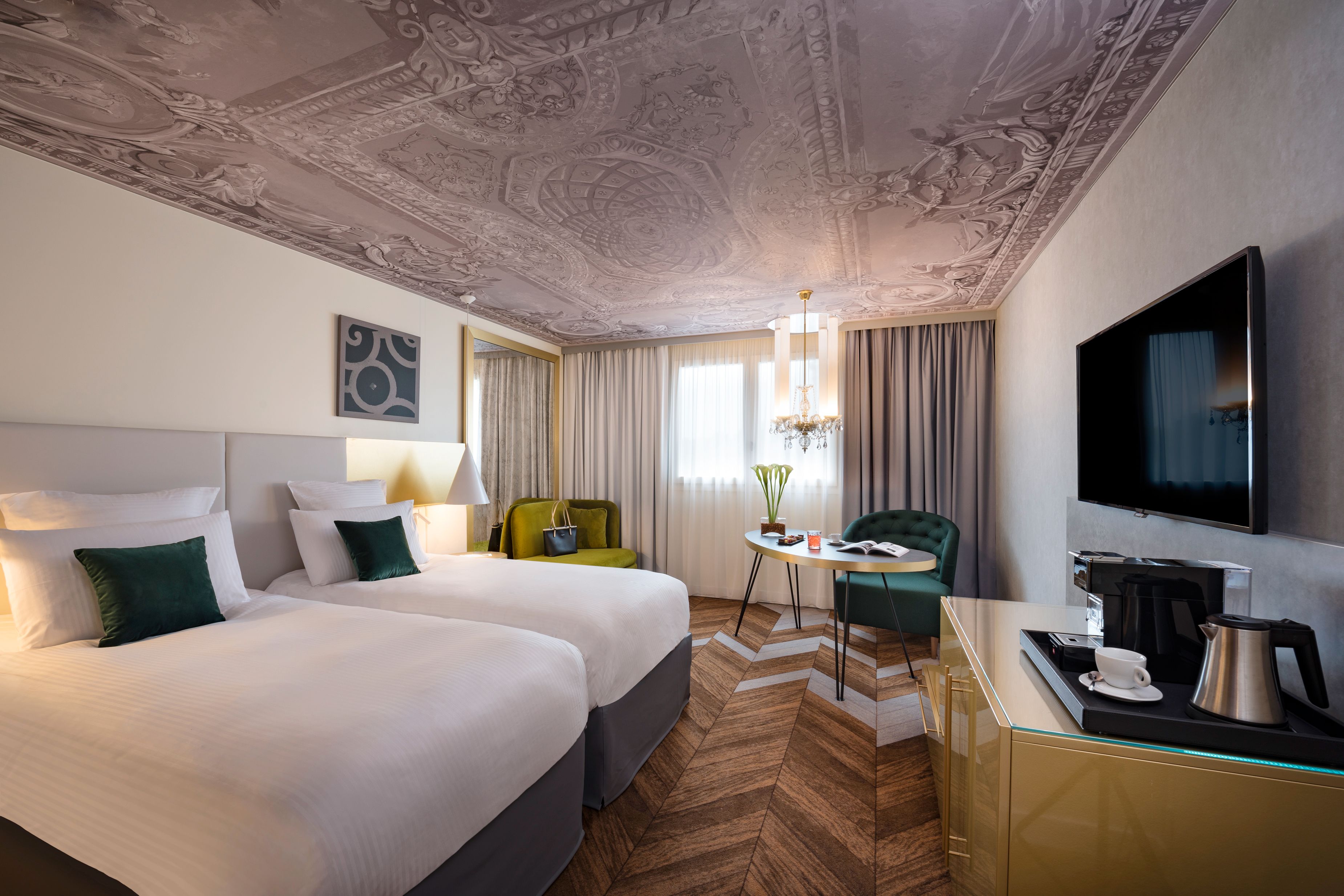 a room with two beds and a tv