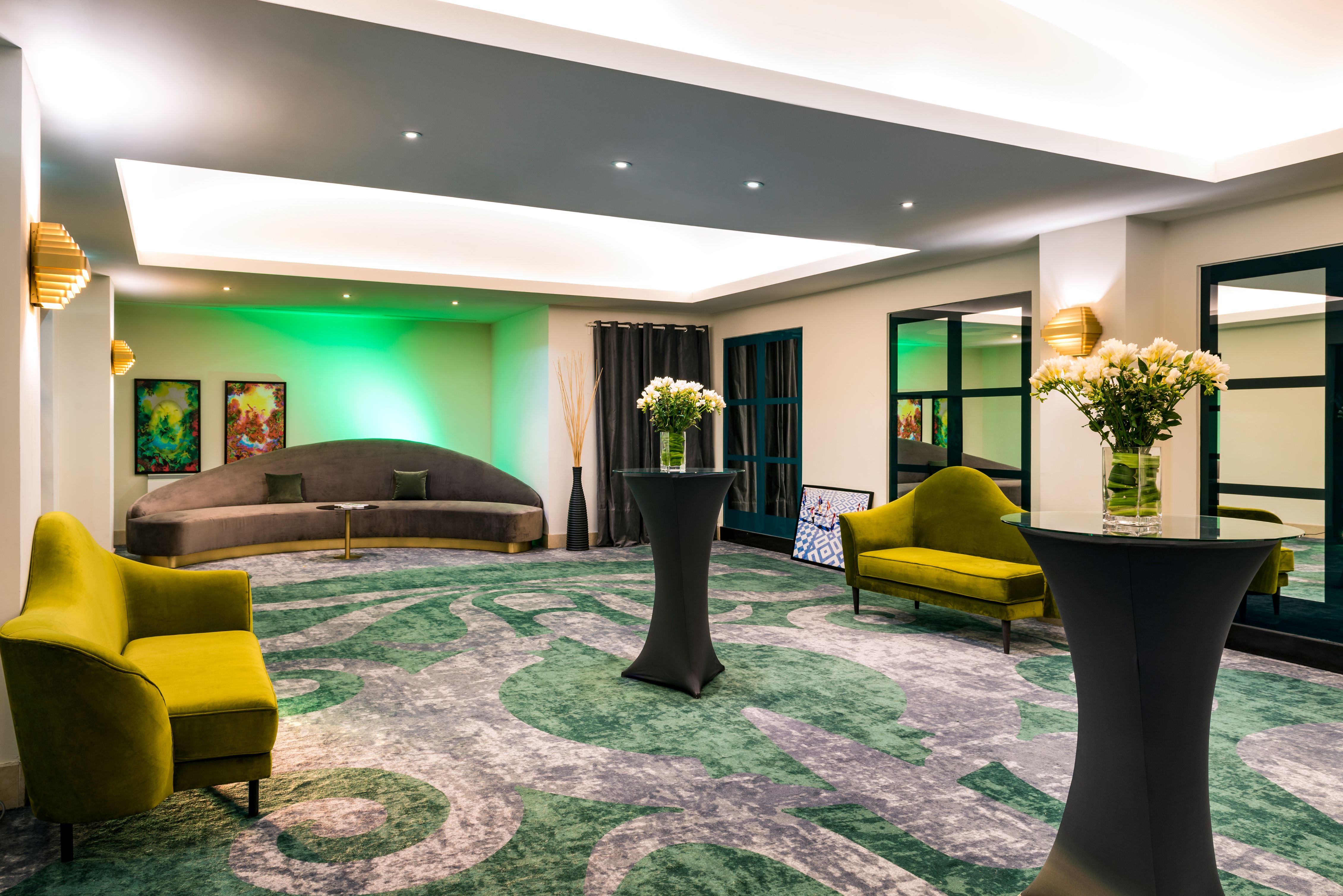 a room with green and white furniture