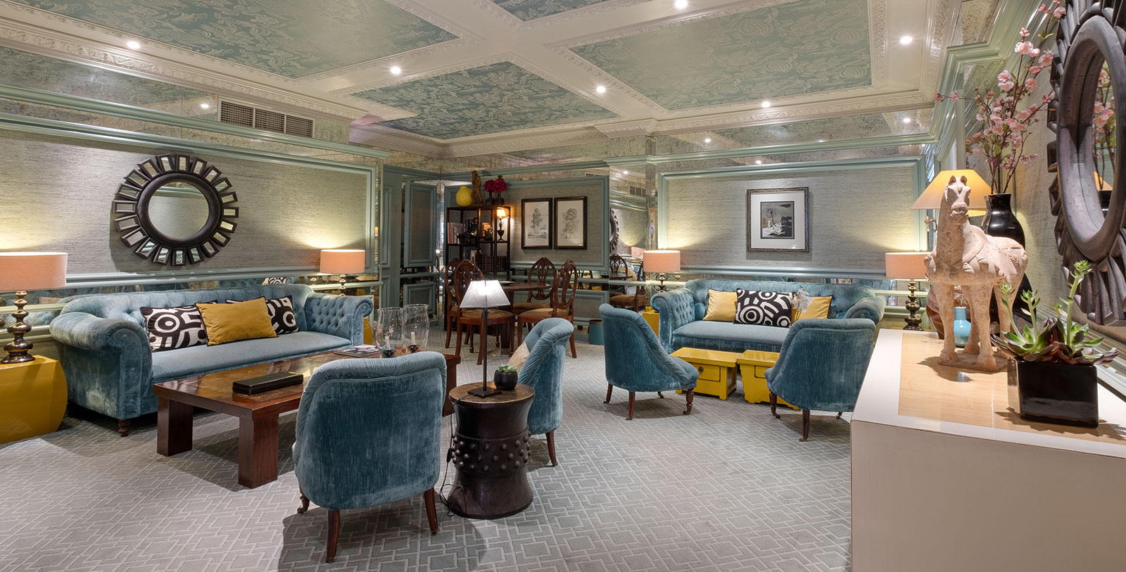 a room with blue furniture and a blue couch