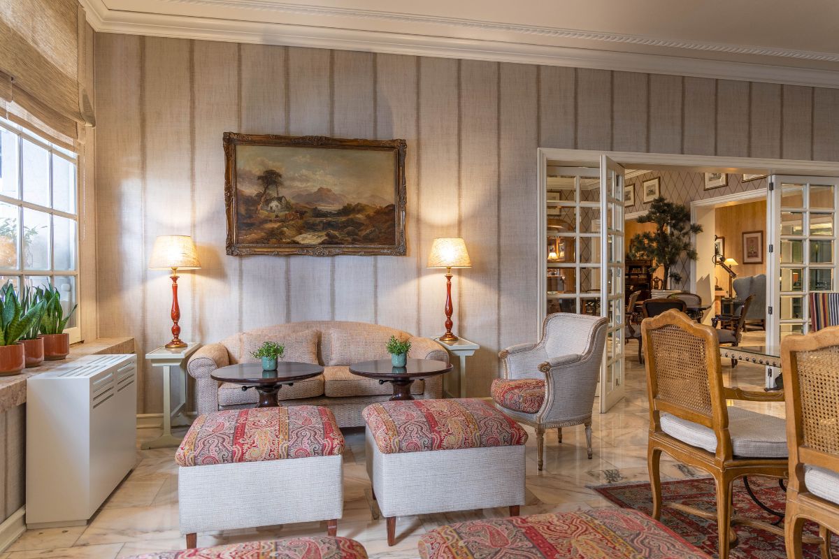 a living room with a couch and chairs