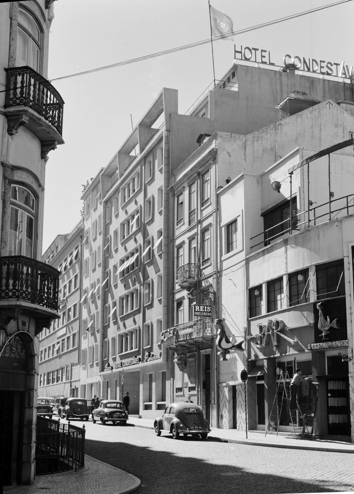 a street with cars and buildings