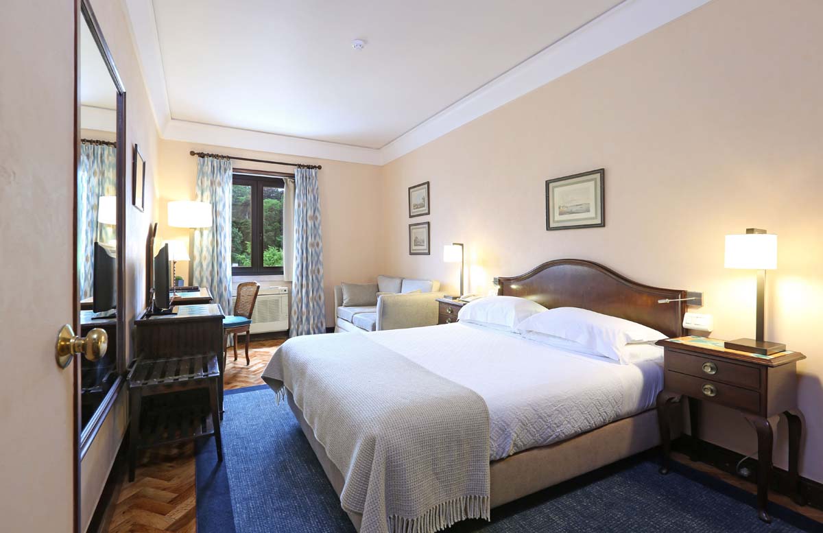 a room with a bed and a desk