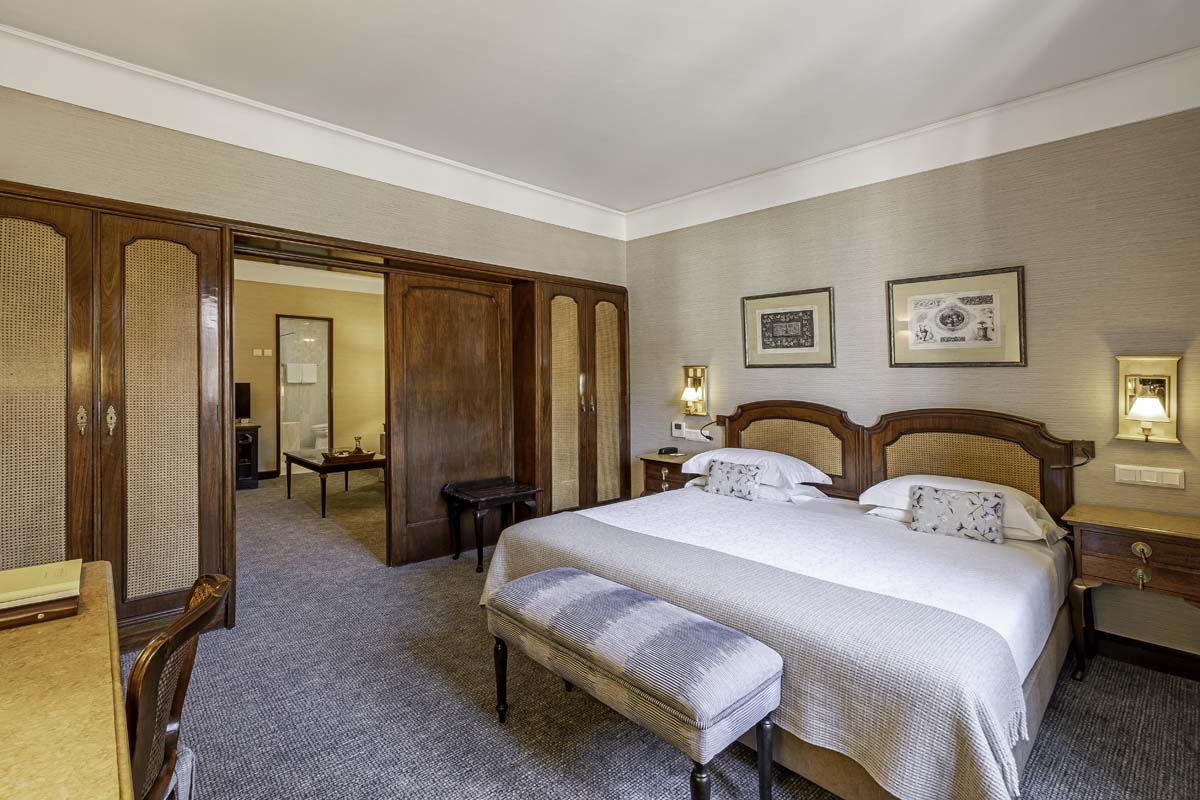 a bedroom with a bed and a door