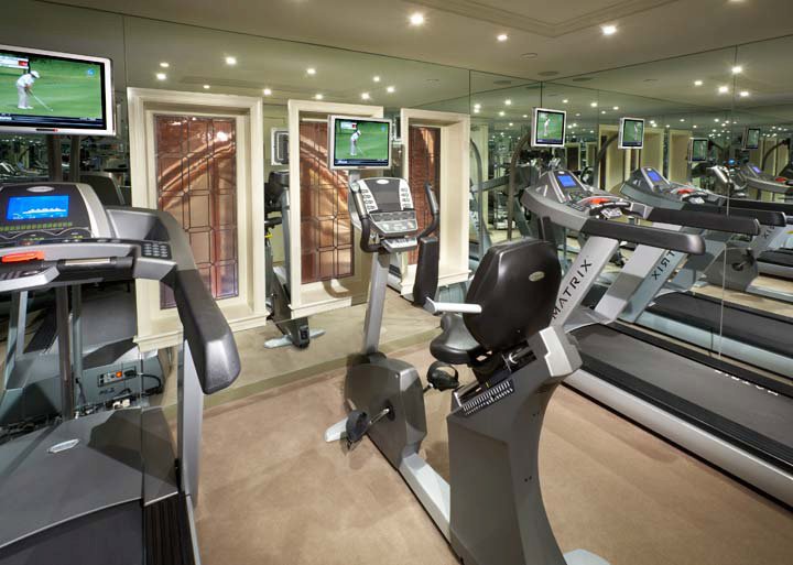 a room with treadmills and exercise machines