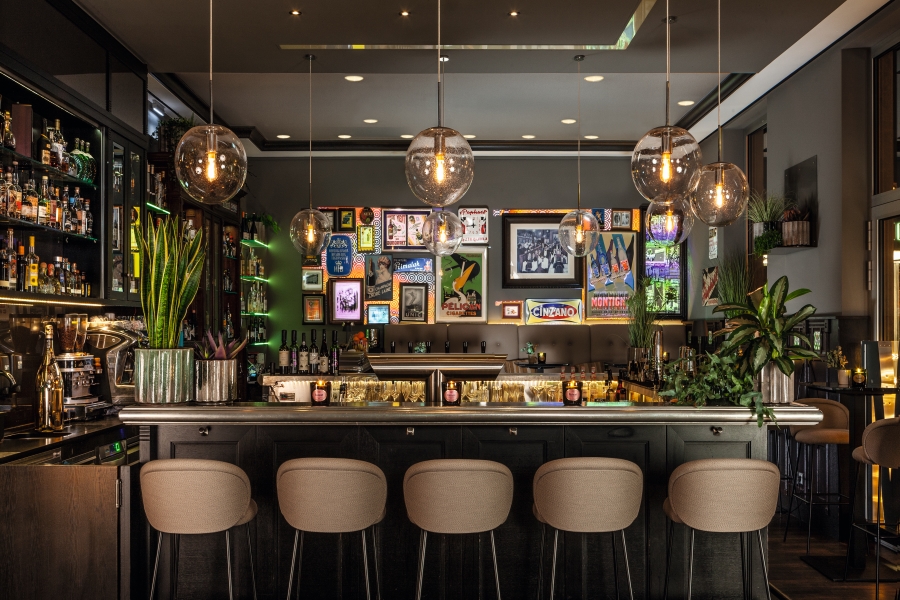 a bar with chairs and lights
