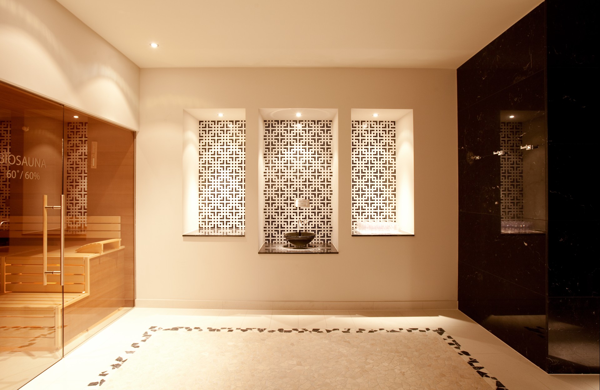 a room with a sink and a sauna