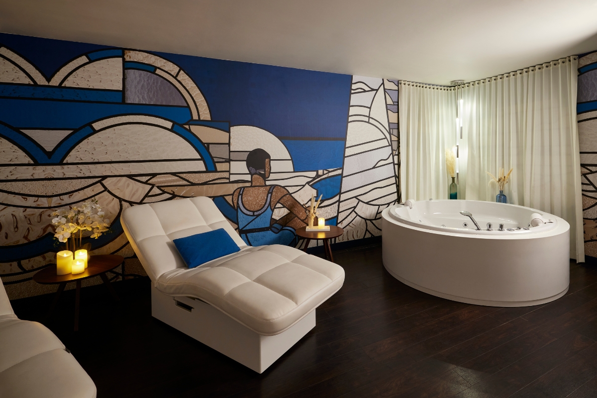 a room with a large tub and a white couch