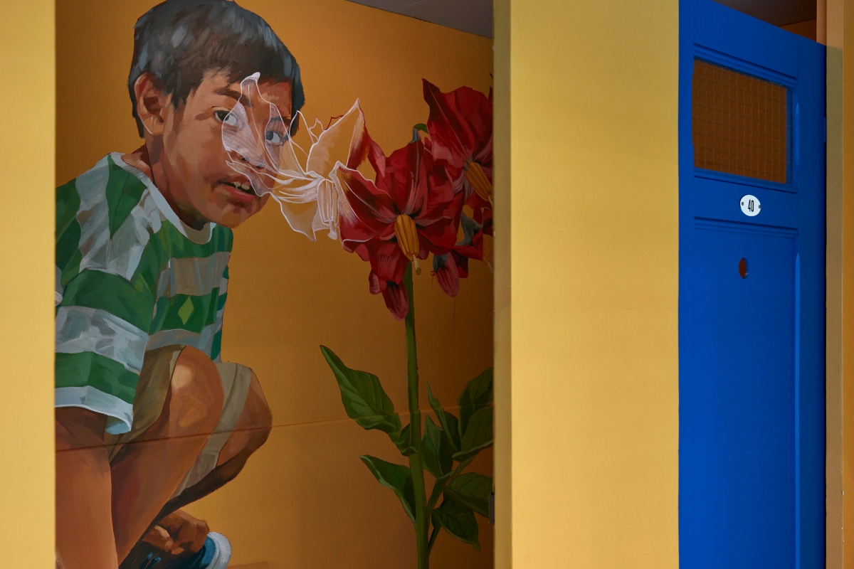 a mural of a boy and a flower