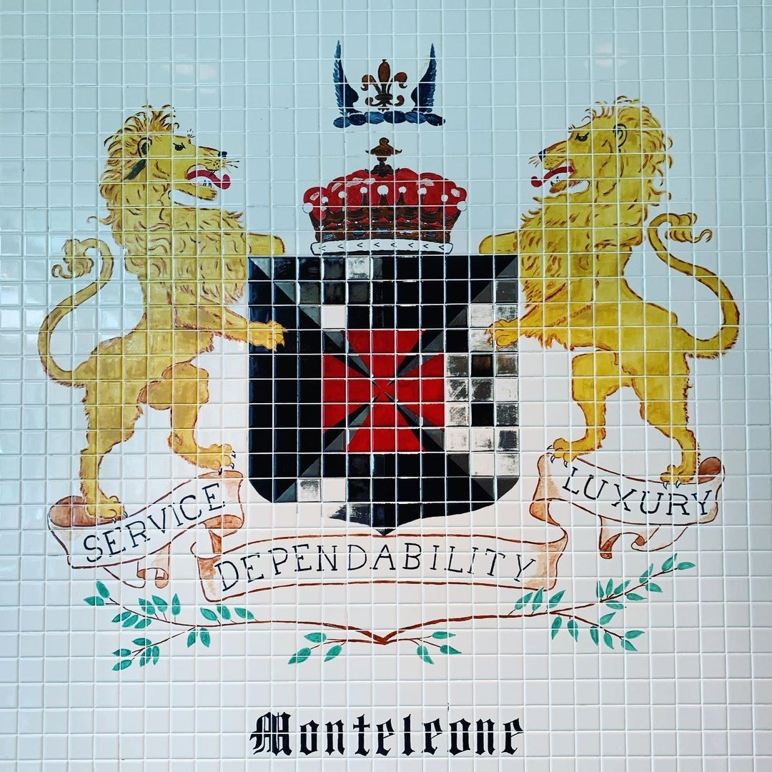 a tile wall with a lion and a lion