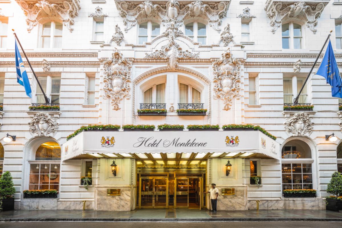 a man standing in front of a hotel