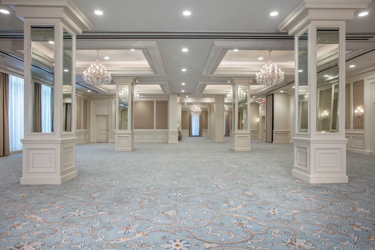 a large room with chandeliers and mirrors