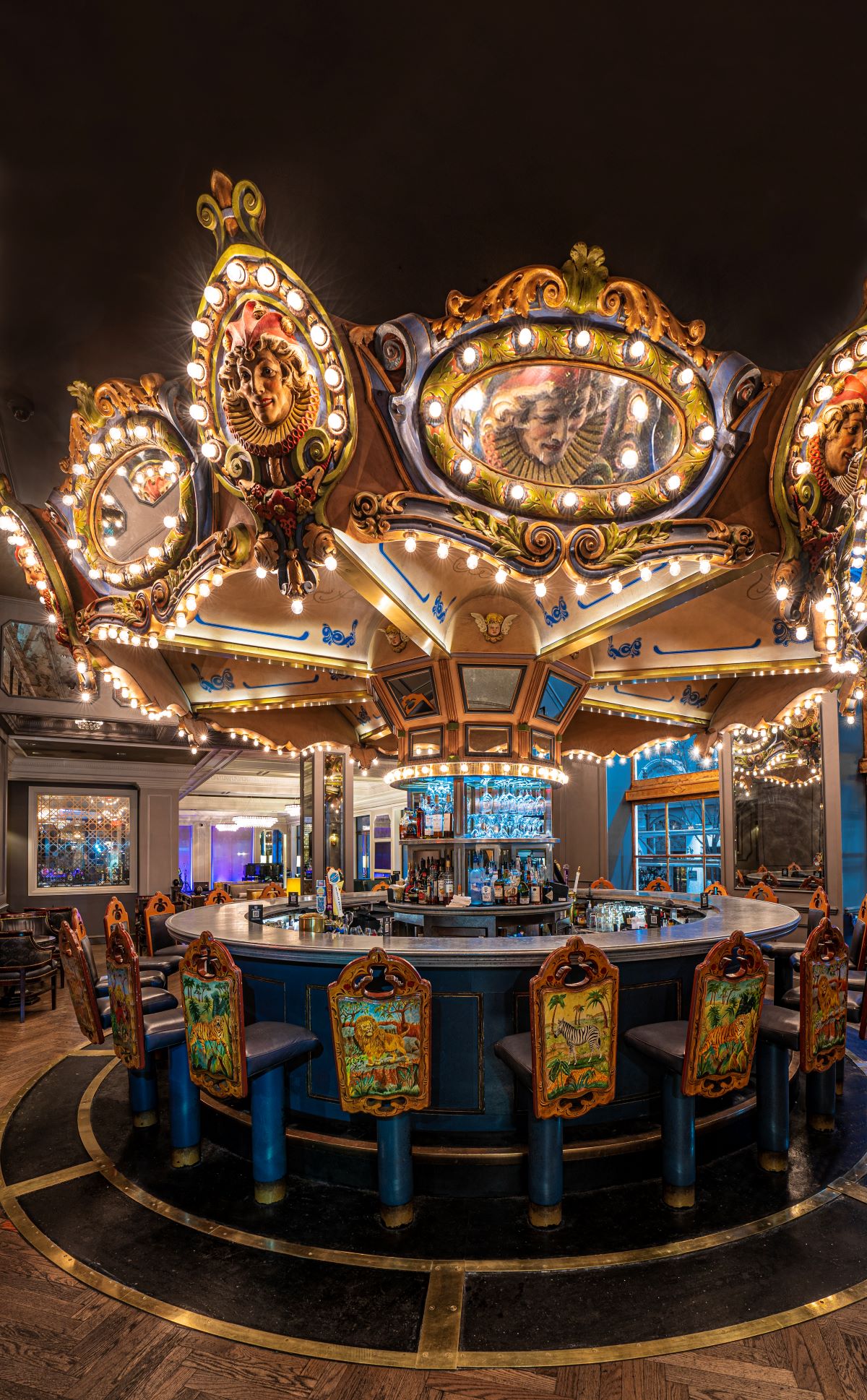 a bar with lights and chairs