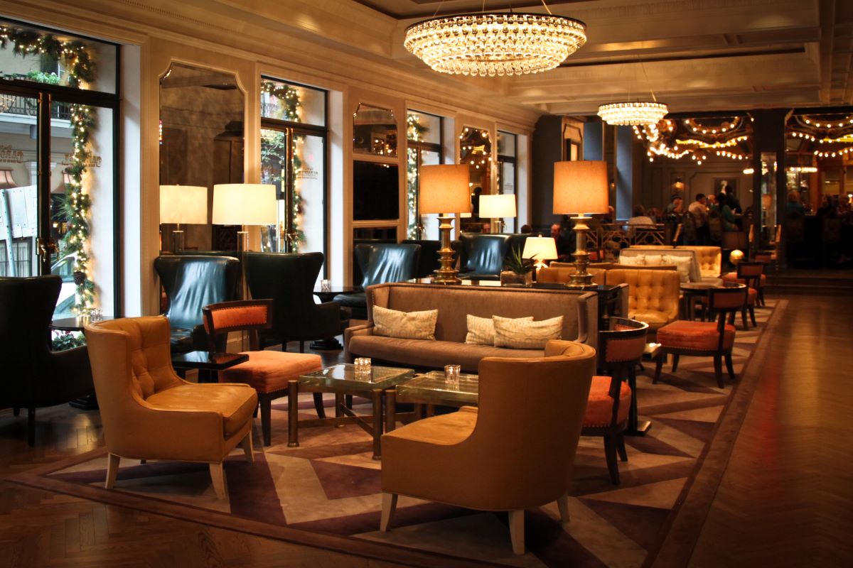 a room with a chandelier and chairs