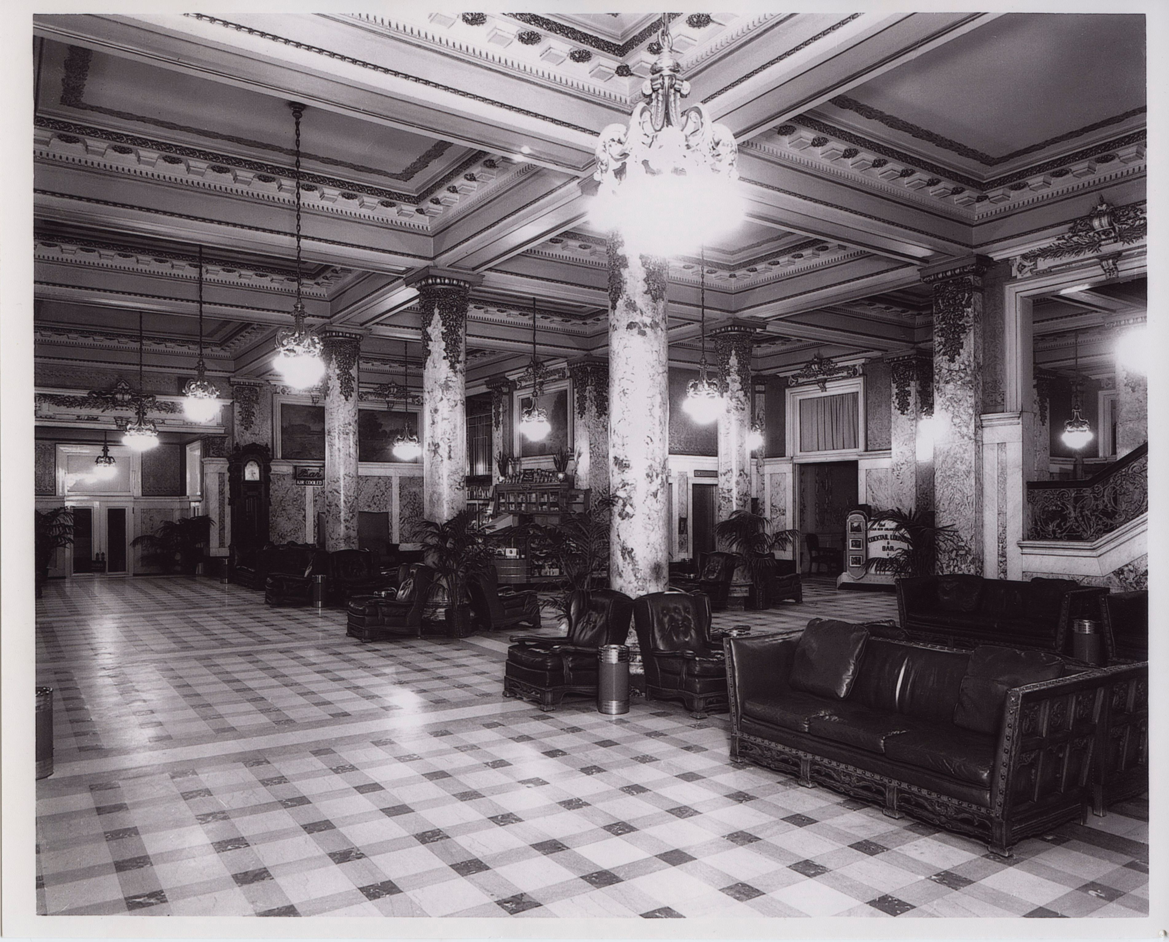 a large room with columns and couches