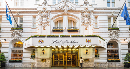a man standing in front of a hotel