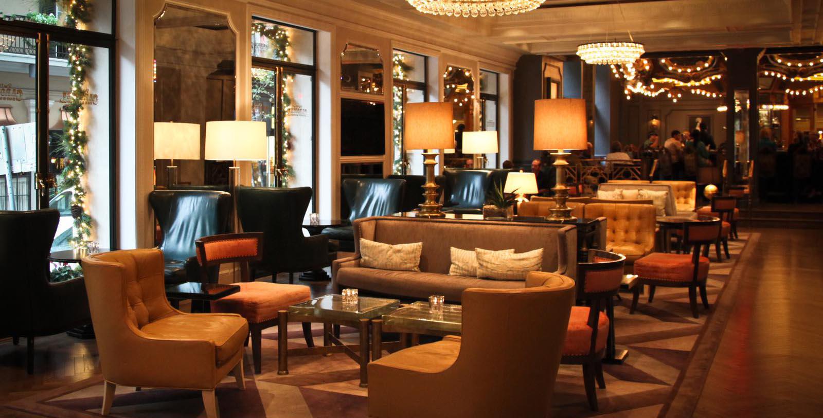 a room with a chandelier and chairs