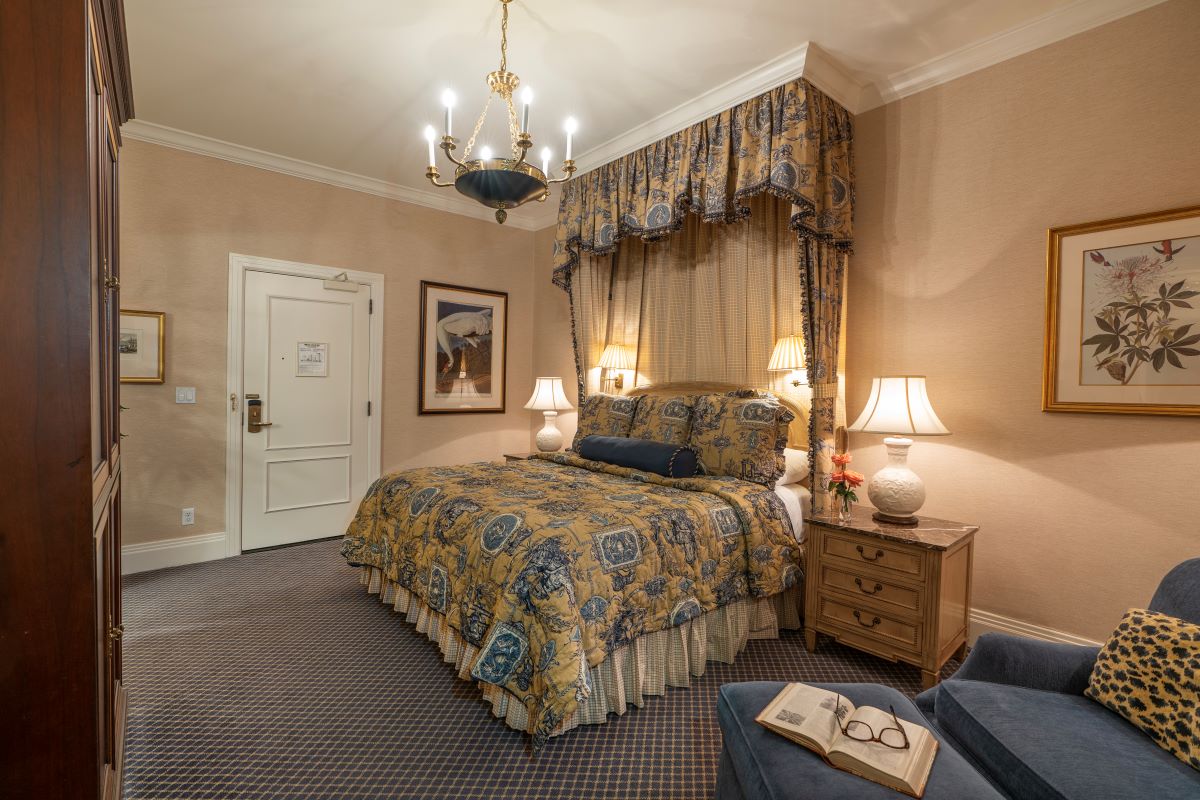 a bedroom with a bed and a chair