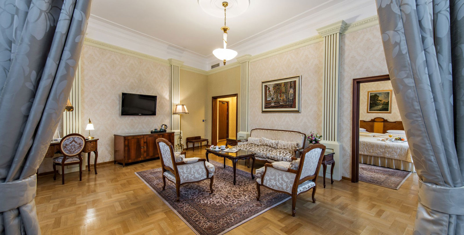 a living room with a couch and chairs