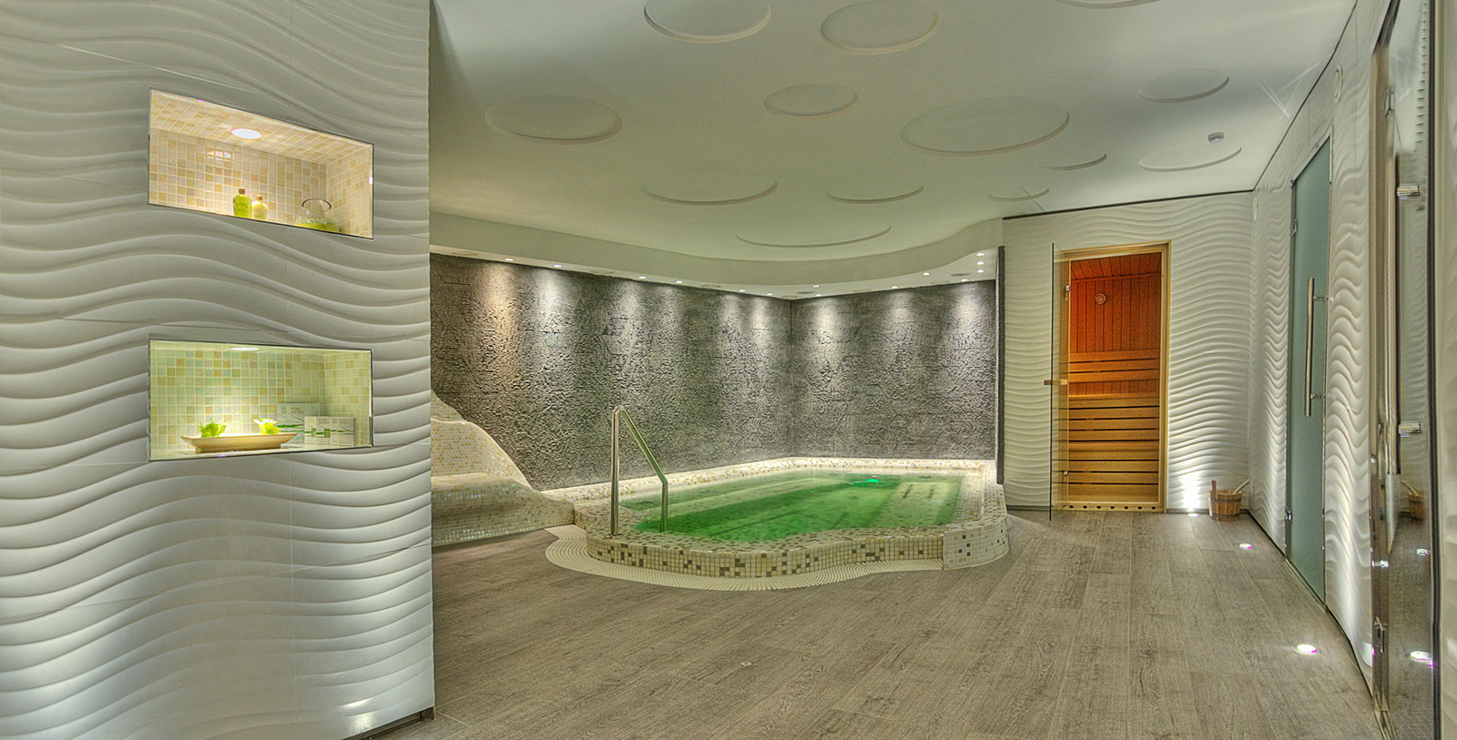 a room with a jacuzzi and sauna