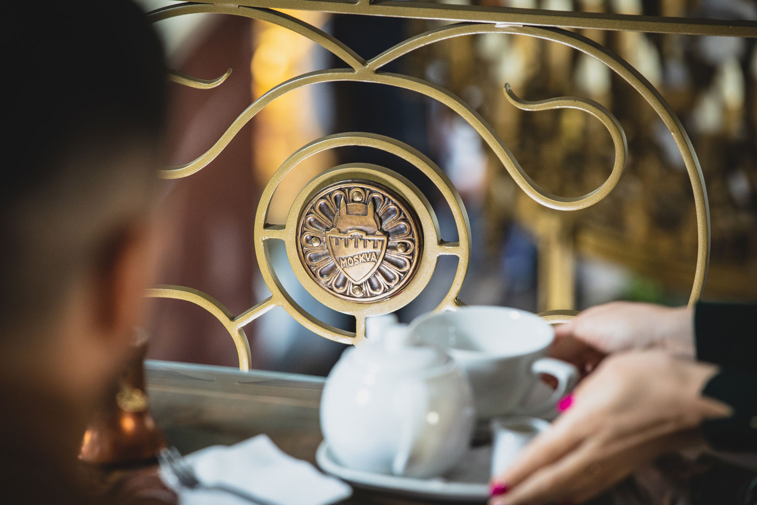 a person holding a tea cup