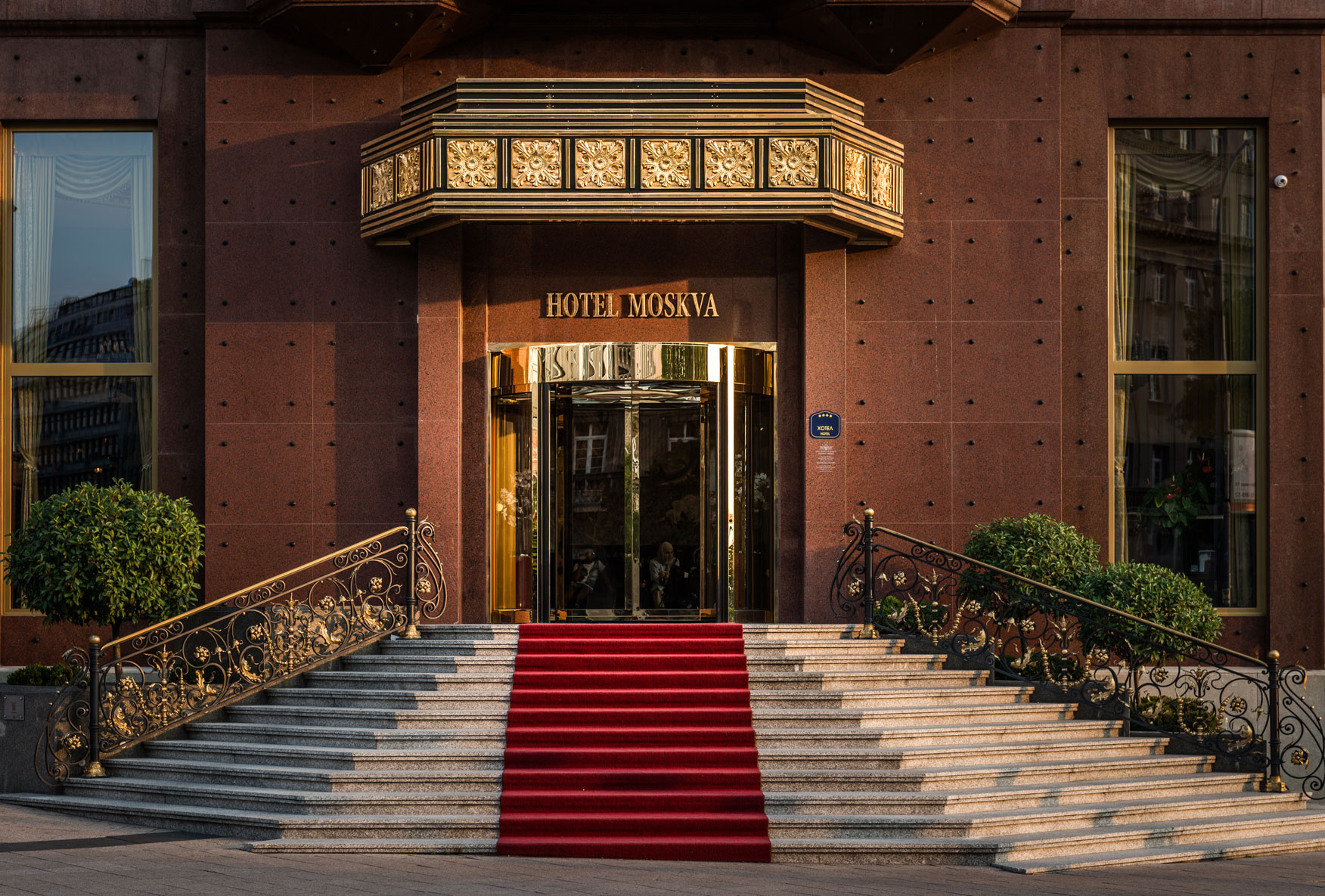 a red carpet on the front of a building