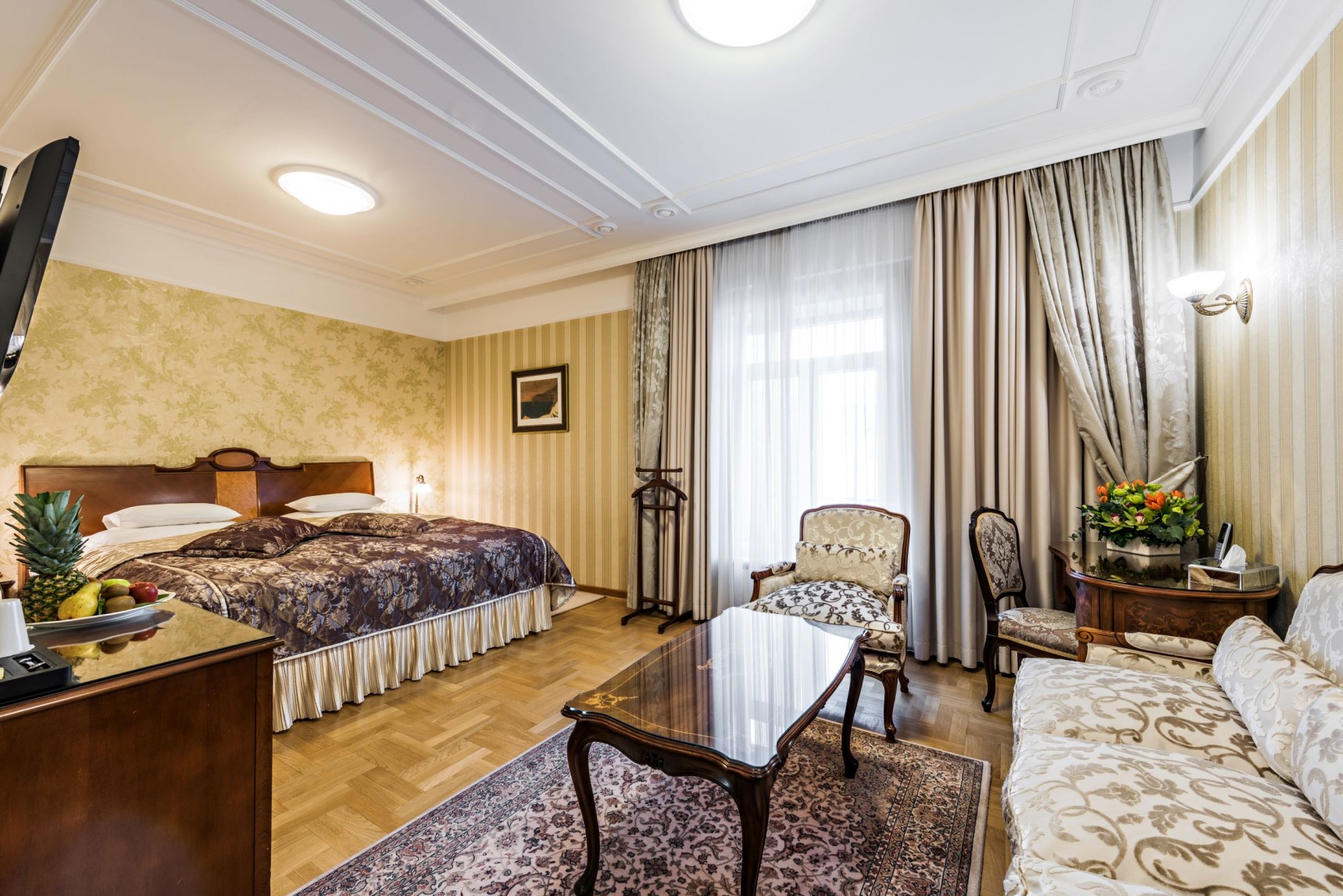 a room with two beds and a table