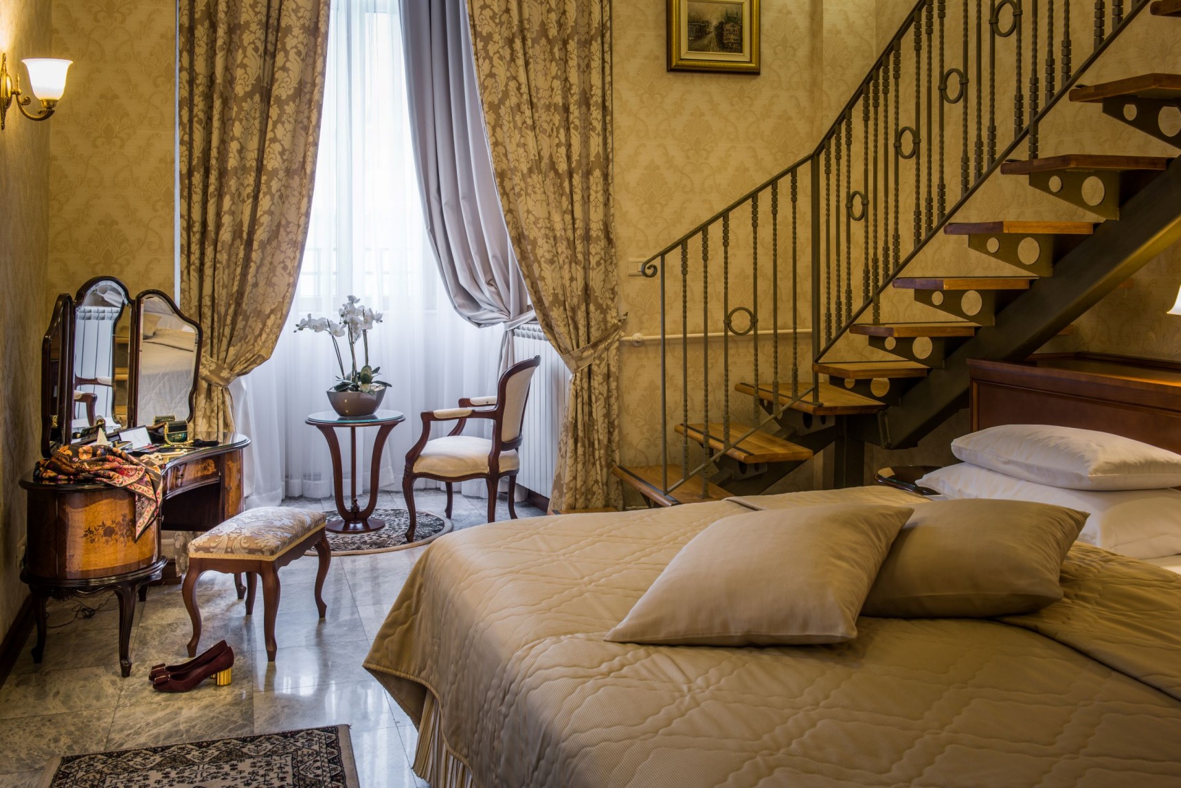 a bedroom with a staircase and a bed