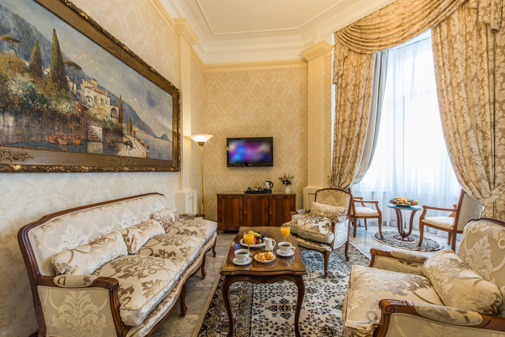 a living room with a tv and couches