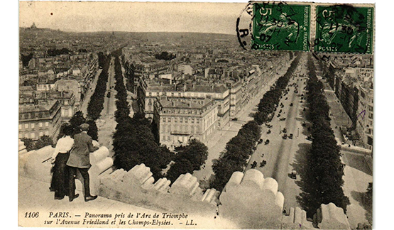 a person standing on a ledge overlooking a city