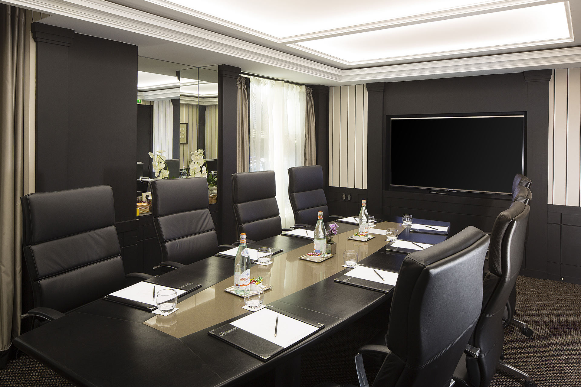 a conference room with a large table and chairs