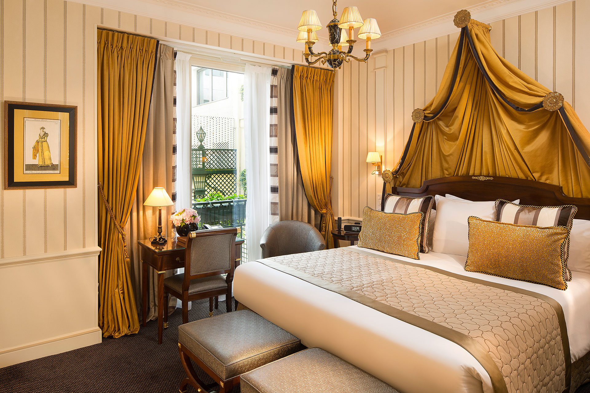 a room with a bed and a chandelier