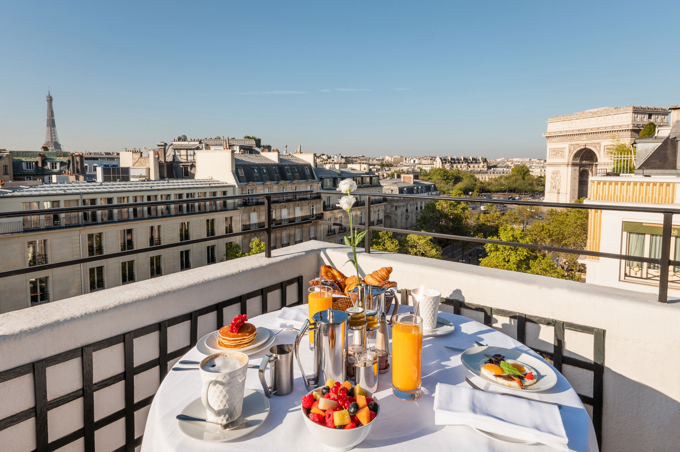 a table with food on it and a view of the city