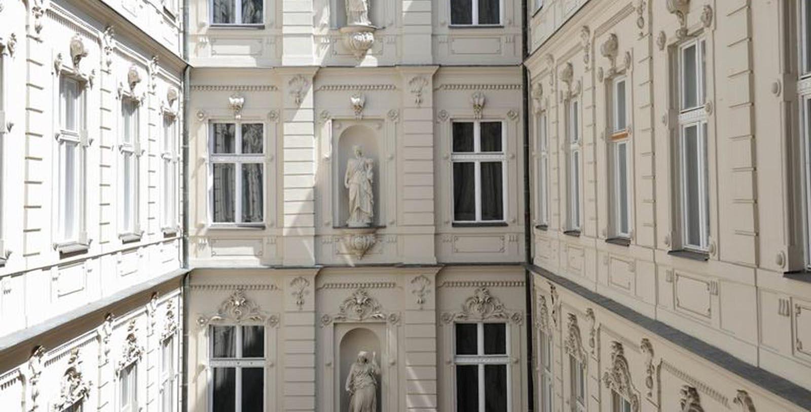 a building with statues on the side