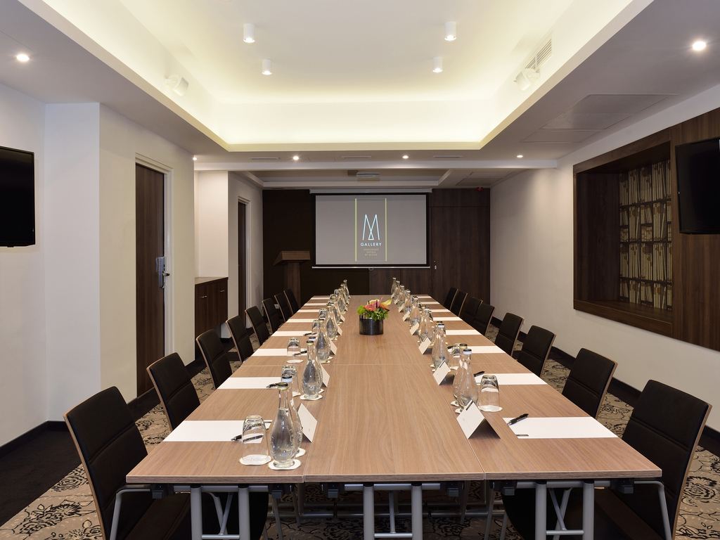 a conference room with a large table and chairs
