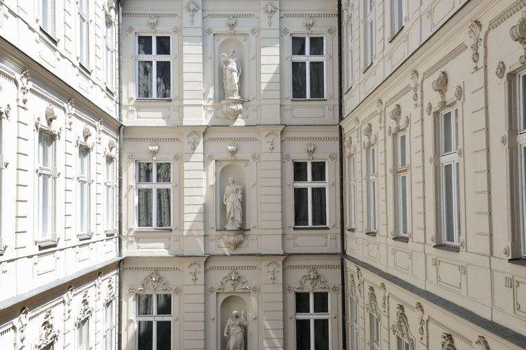 a building with statues on the side