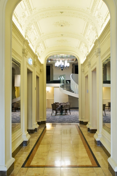 a hallway with a spiral staircase