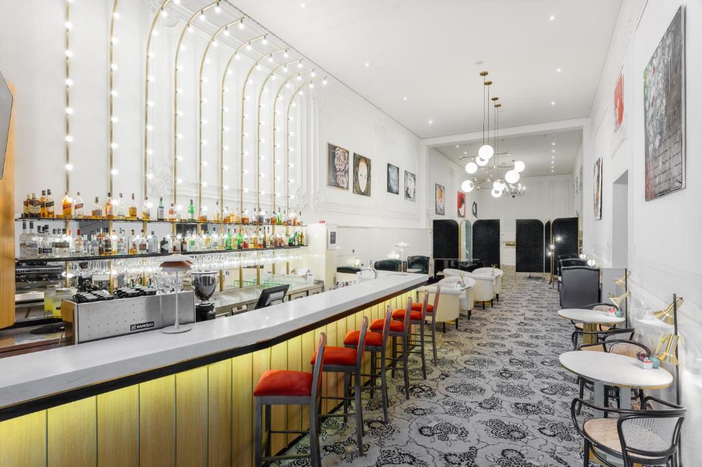 a bar with many bottles and lights