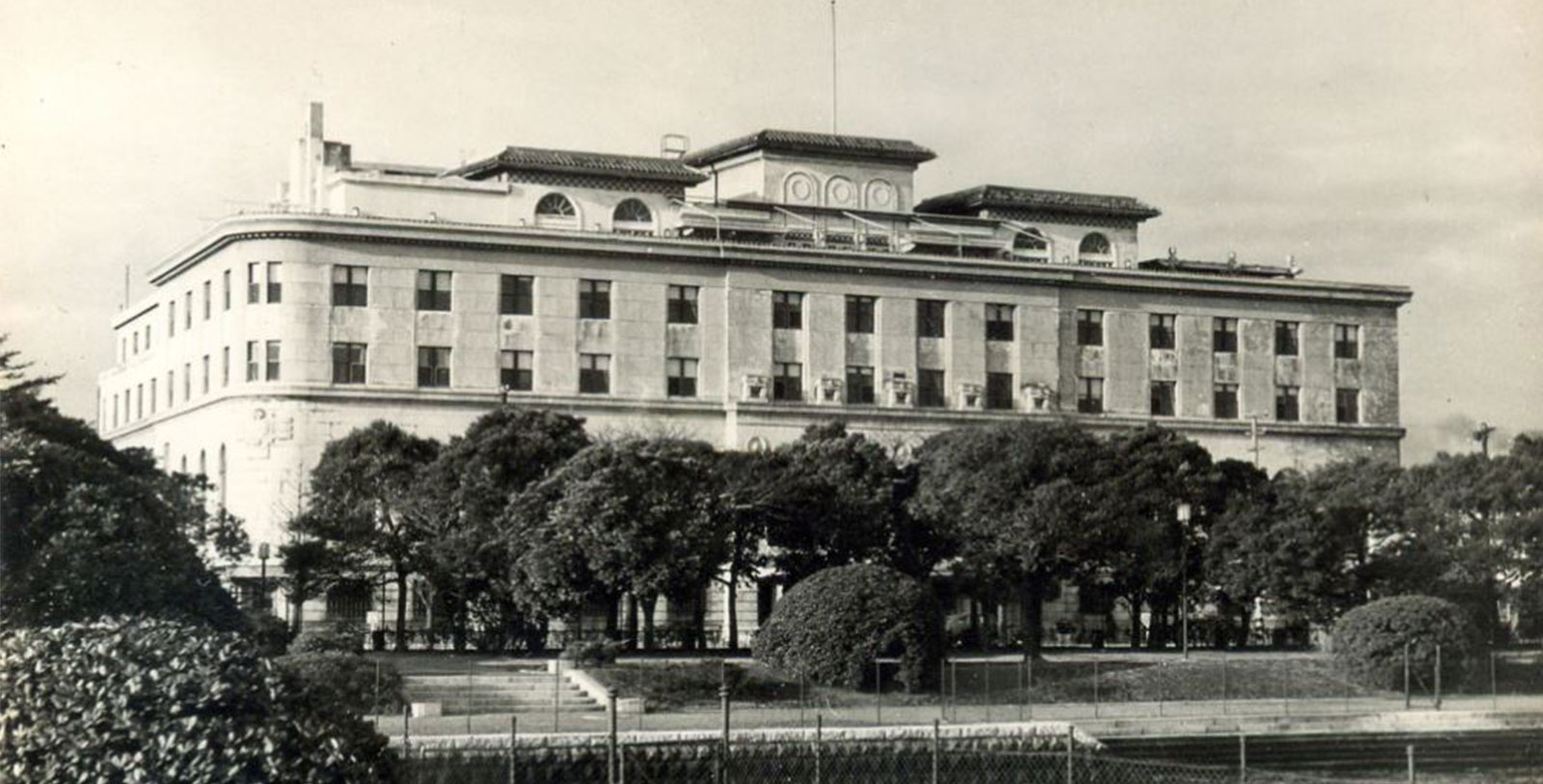 a building with trees in front of it