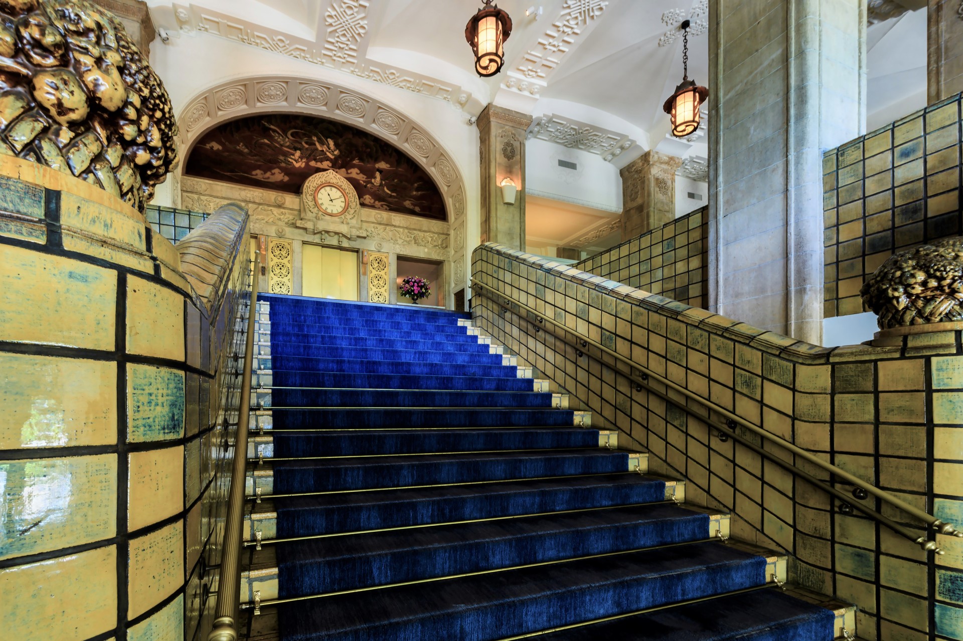 a blue carpeted stairs in a building