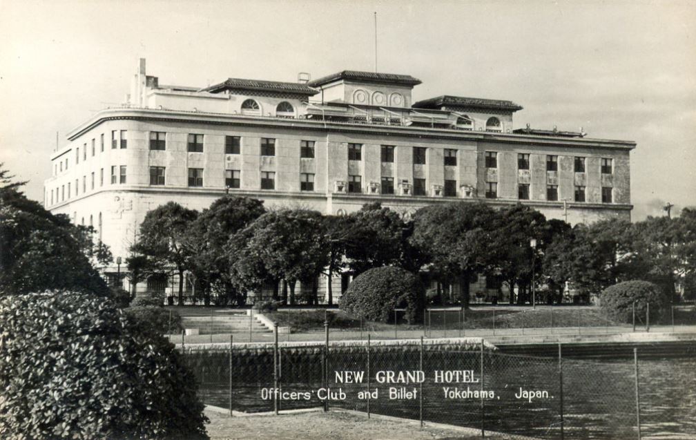 a large building with trees in front of it