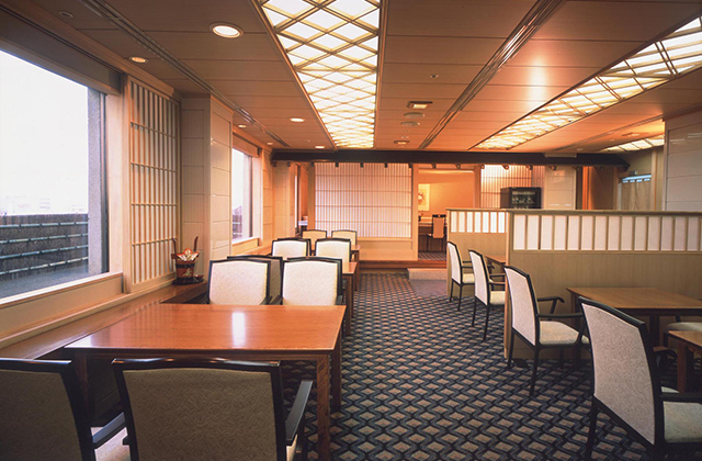 a room with a table and chairs