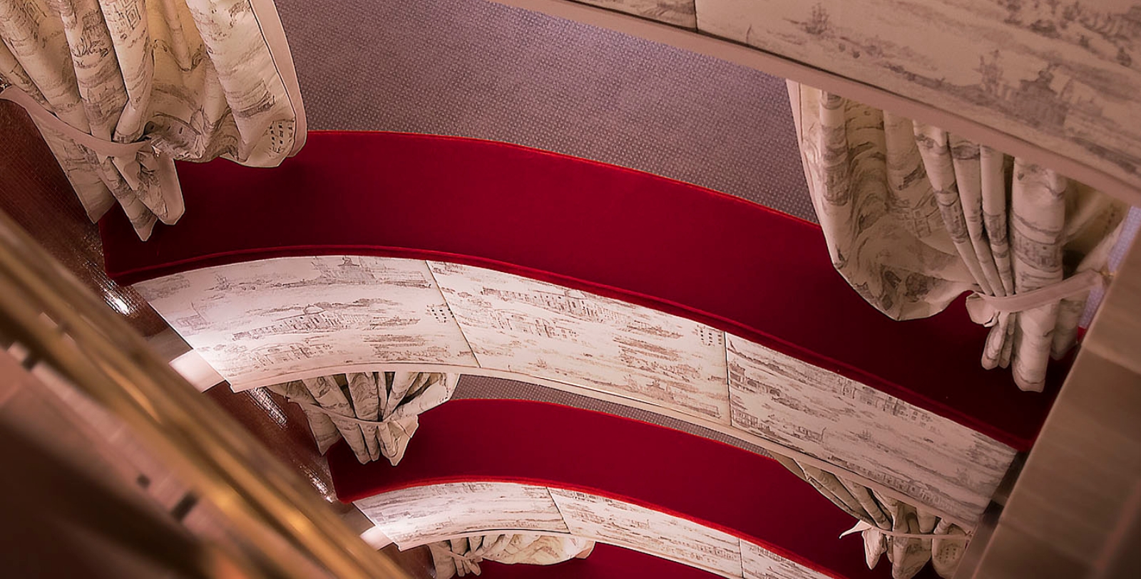 a red and white curved bench