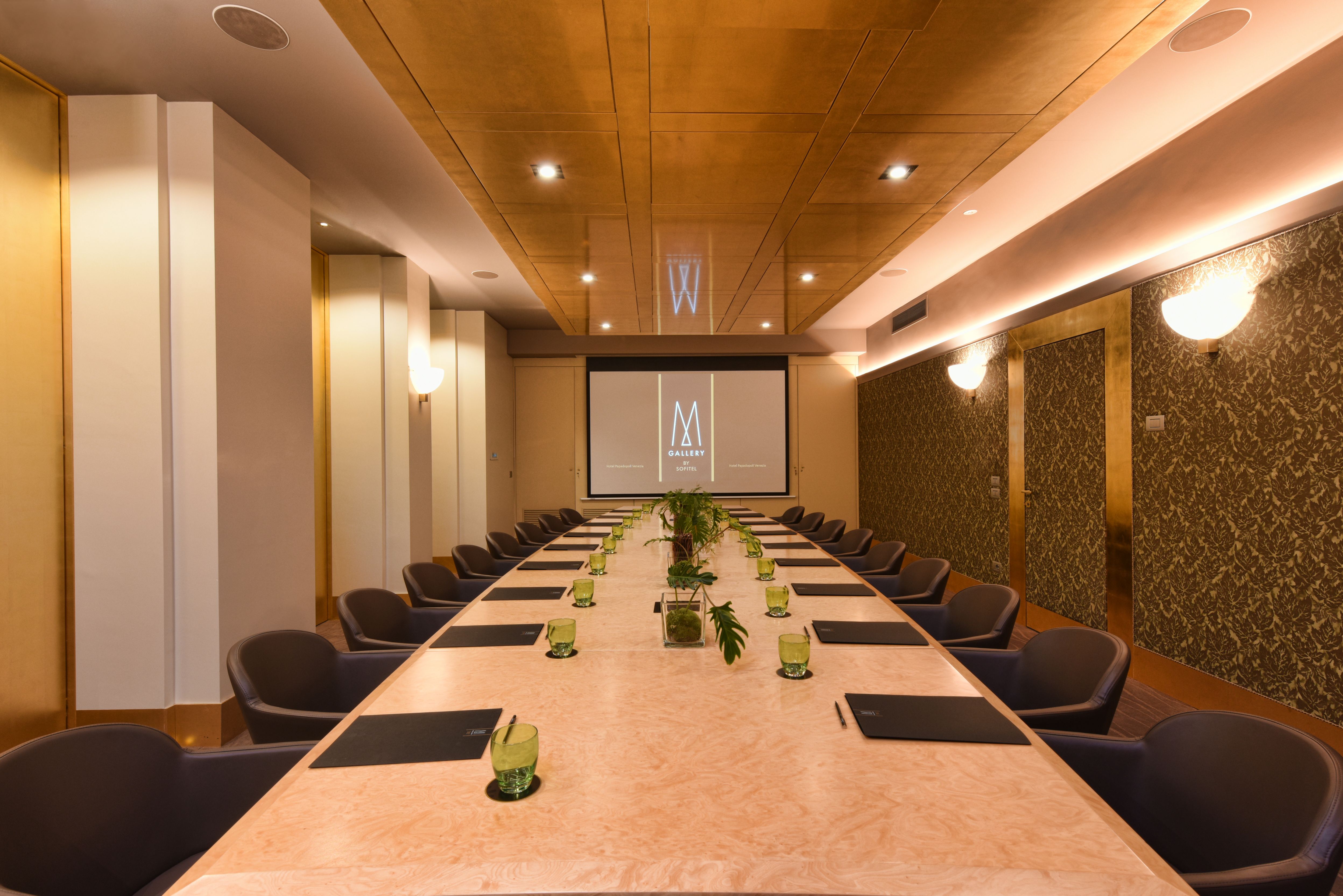a conference room with a large table and chairs