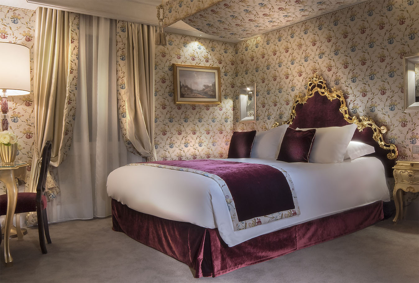 a bed with purple and gold bedding