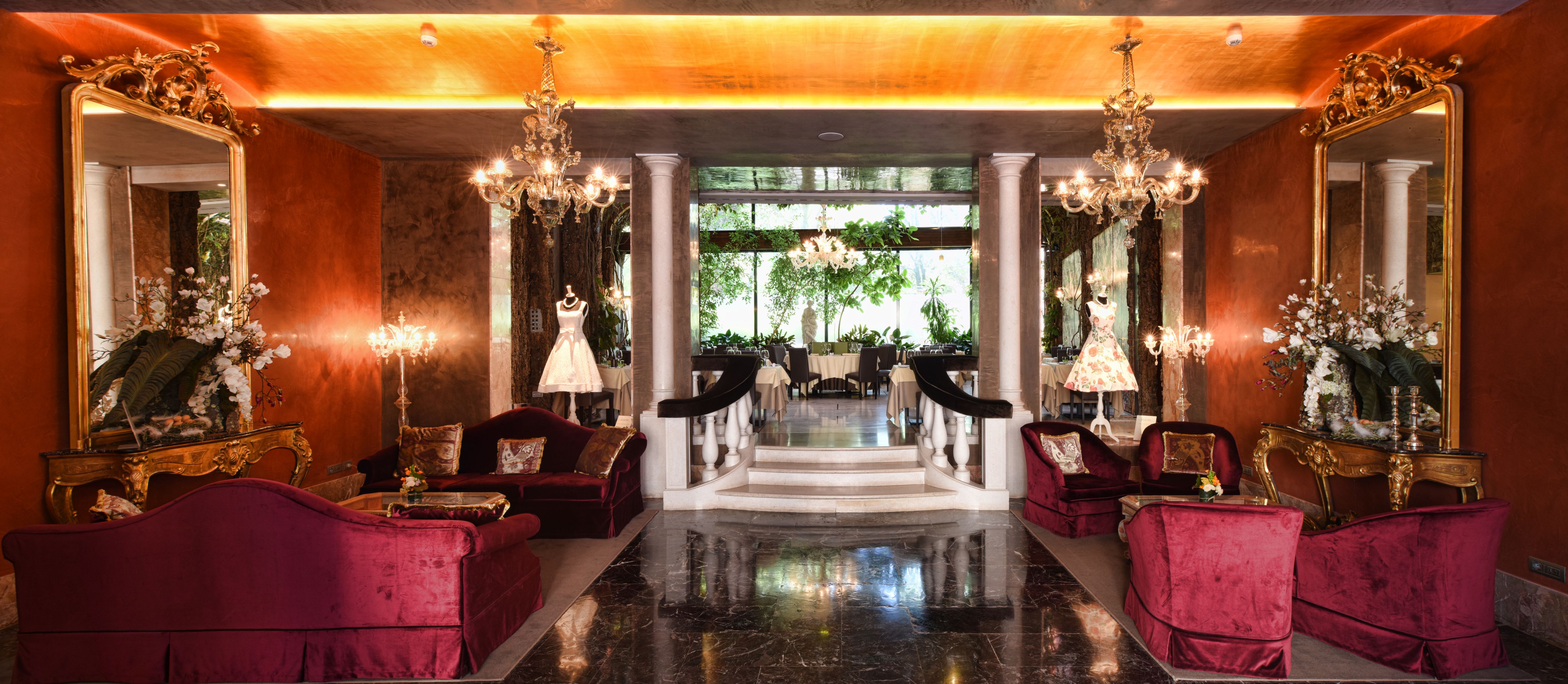 a room with chandeliers and a staircase